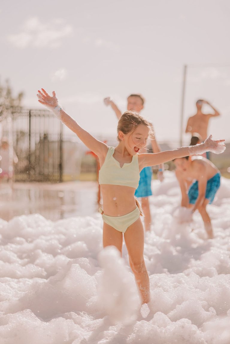 Kids splashing and playing at Jellystone Park Zion water zone
